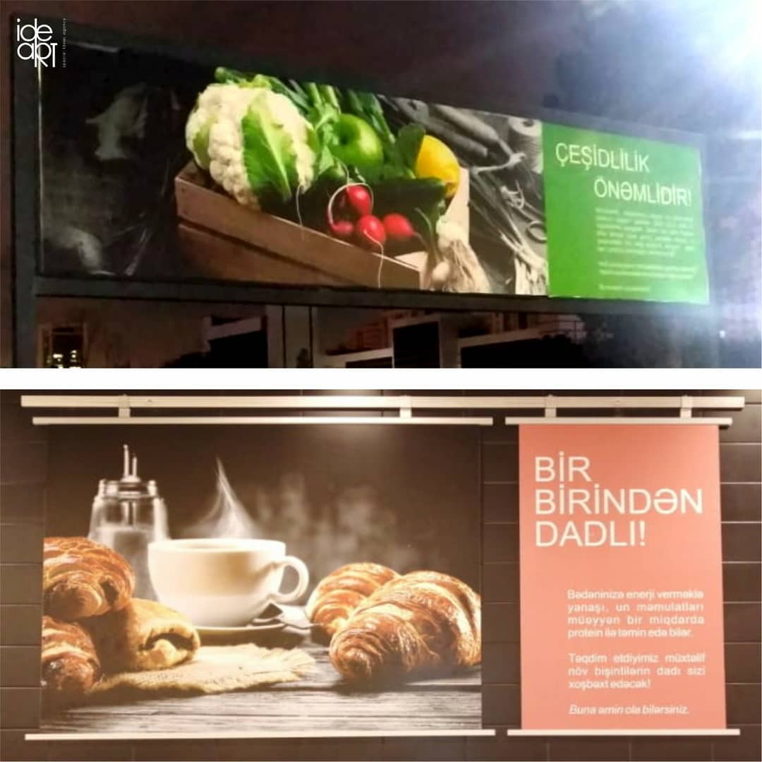 Advertising panels featuring vegetables, coffee and croissants